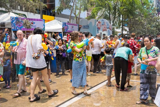 Siam Square, Bangkok, Thailand - APR 13, 2023 Songkran Festival, The short action of people joins celebrations of the Thai New Year or Songkran in Siam Square Bangkok, Thailand.
