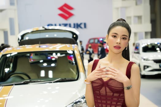 Nonthaburi, Thailand - APR 2, 2023 Unidentified model poses with a car at The 44th Bangkok international motor show 2023 at IMPACT Arena, Muang Thong Thani, Nonthaburi, Thailand.