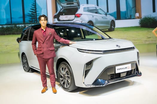 Nonthaburi, Thailand - APR 2, 2023 Unidentified model poses with a car at The 44th Bangkok international motor show 2023 at IMPACT Arena, Muang Thong Thani, Nonthaburi, Thailand.