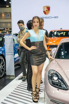 Nonthaburi, Thailand - APR 2, 2023 Unidentified model poses with a car at The 44th Bangkok international motor show 2023 at IMPACT Arena, Muang Thong Thani, Nonthaburi, Thailand.