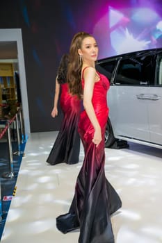 Nonthaburi, Thailand - APR 2, 2023 Unidentified model poses with a car at The 44th Bangkok international motor show 2023 at IMPACT Arena, Muang Thong Thani, Nonthaburi, Thailand.