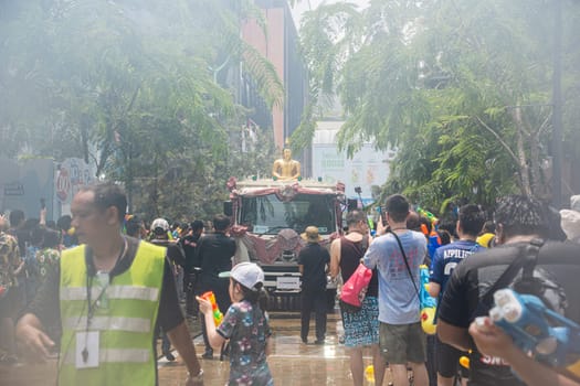 Siam Square, Bangkok, Thailand - APR 13, 2023 Songkran Festival, The short action of people joins celebrations of the Thai New Year or Songkran in Siam Square Bangkok, Thailand.