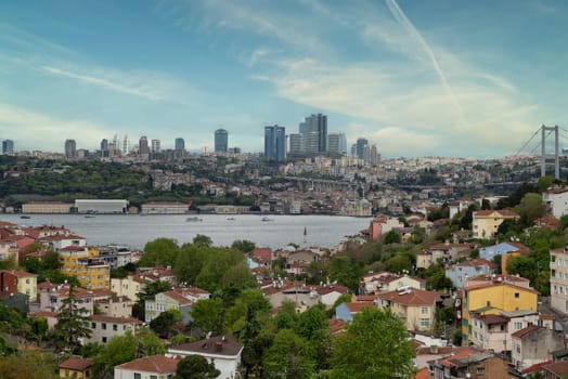 Cityscape of Istanbul, Turkey in there morning, with a skyline including Bosphorus strait, tall buildings on the European side, and Bosphorus Bridge