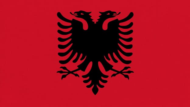 Flag of Albania. Albanian flag on fabric surface. Fabric texture. Albanian national symbol of Albania on patterned background. Balcan country. European country. Republic of Albania