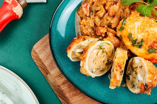 Sliced baked clams, squid stuffed with rice and nettle on a light grey background. Korea food.