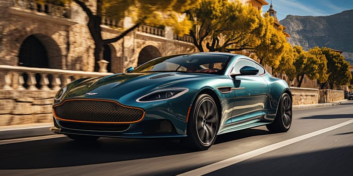 Front view of a sports car moving along aspalted road in sunlights, widescreen. Luxury and success concept