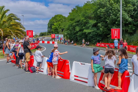 Bayonne, France: 03 July 2023: People in the streets waiting for the Caravan of Tour de France in the 3 stage of "Le Tour de France"" in Bayonne, Basque Country. France."