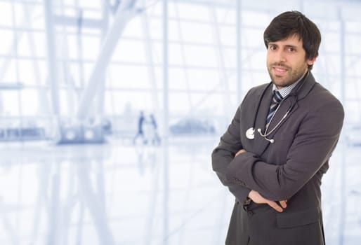 happy male doctor, at the hospital