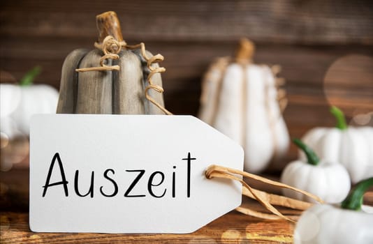 Autumn Decoration With Pumpkins, Rustic fall Decoration With Label With German Text Auszeit, which Means Downtime
