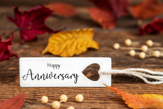 Autumn or Fall Background with Label with English Text Happy Anniversary, Colorful Autumn Leaves, Seasonal Background with Quote