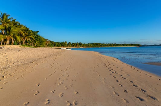 Nacula, Fiji: 26 May 2023: Boats in the stunning idyllic blue lagoon beach in the Yasawa island in Fiji in the south Pacific ocean