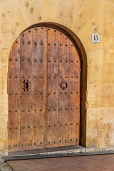 Oviedo, Spain: 29 July 2023: Old wooden door in Oviedo, Asturias. Spain