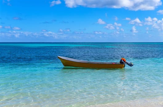 Boat in the stunning idyllic blue lagoon beach in the Yasawa island in Fiji in the south Pacific ocean