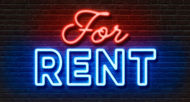 Neon sign on a brick wall - For rent