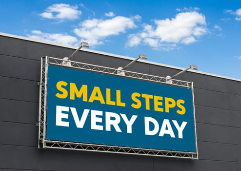 Small steps every day written on a billboard