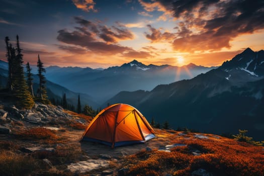 Tourist tent in the mountains under dramatic evening sky. Colorfull sunset in mountains. Camping travell concept. Traveler people enjoying the advanture alternative vacation