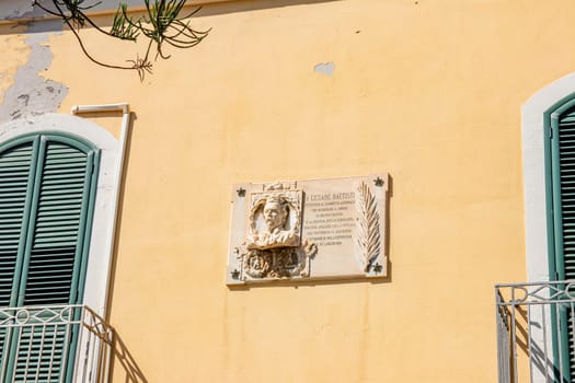 MILAZZO, SICILY, Italy - 03 October 2023. A plaque commemorates the heroic actions of Cesare Battisti in the World War I and is located in the square named after him.