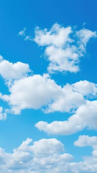 Background of blue sky with snow-white clouds. vertical background