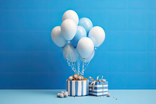 White gift box with blue ribbon and white balloon with blue stripes on blue background. minimal birthday and celebration concept.