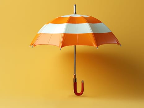 orange white striped umbrella on yellow background copy space. autumn abstract background