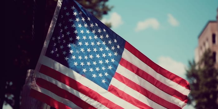 Close up United States of America flag on the blue sky background.