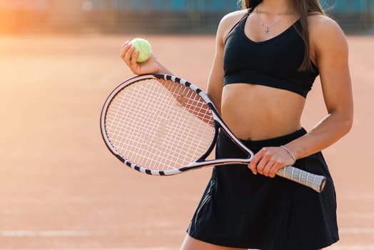 Sports Fashion. Beautiful Woman On Tennis Court. Portrait Of Stylish Sexy Girl In Black Trendy Sportswear Holding Tennis Racket On Outdoor Court. High Resolution.