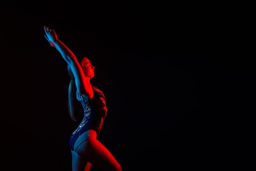 Fashion girl ballet dancer. Sport gymnastics studio shot on a white and black background