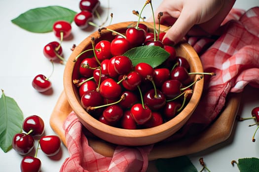 Juicy cherry berries in a wooden bowl on a wooden background.