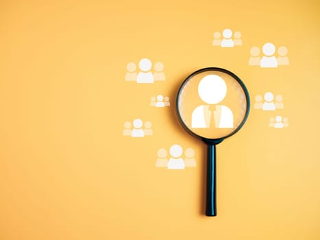 Team management concepts, human resources, recruitment concepts, human resource management or human resource management concept, Manager icon in magnifying glass placed on yellow background.