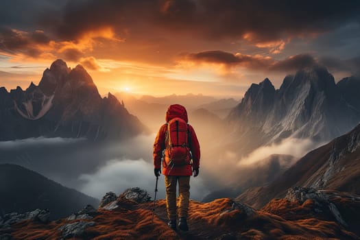 A hiker walking on a mountain meadow in spring or autumn. Hiking in the Lusatian mountains. Hiker, Backpacking on top of a mountain cliff landscape and trekking in it. Concept: Adventure, Art, Travel
