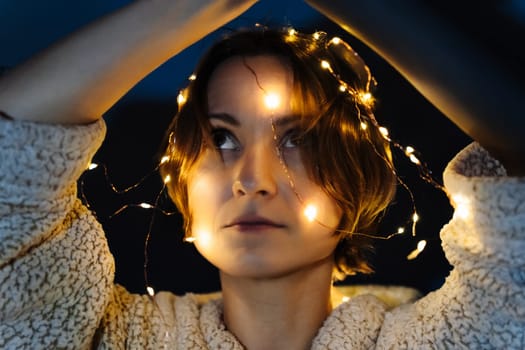 Portrait of a short-haired woman with lights on the glove box
