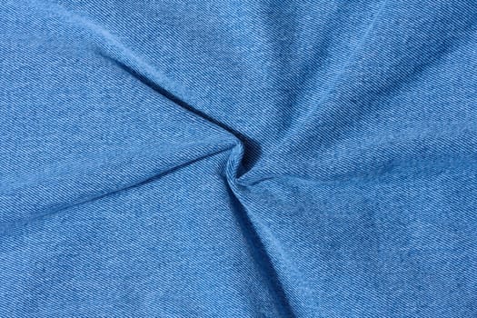 Blue denim, fabric twisted, close up