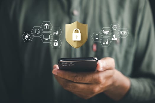 Prioritize data protection and privacy in digital age. Businessmen safeguard personal information on smartphone and virtual interfaces with shield lock icons and advanced network security technology.