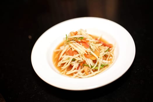 Somtam is a popular Thai food that originated in the northeastern region of Thailand. It is often served as a main course or as an appetizer. They usually taste sour, salty, sweet, and spicy.