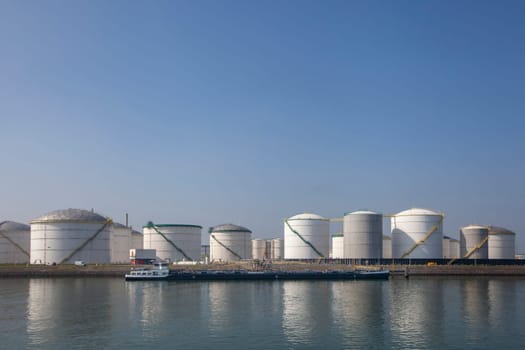 Oil refinery plant from industry zone, Aerial view oil and gas industrial, Refinery factory oil storage tank and pipeline steel