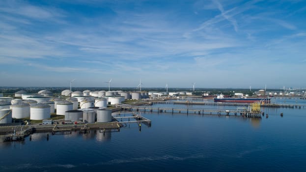 Oil refinery plant from industry zone, Aerial view oil and gas industrial, Refinery factory oil storage tank and pipeline steel