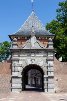 Medieval archway to the port of the picturesque village Schoonhoven near the river Lek in the Netherlands