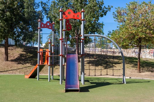Colorful playground on yard in the park, An image of colorful children playground, without children