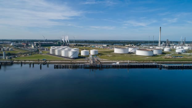 Oil refinery plant from industry zone, Aerial view oil and gas industrial, Refinery factory oil storage tank and pipeline steel