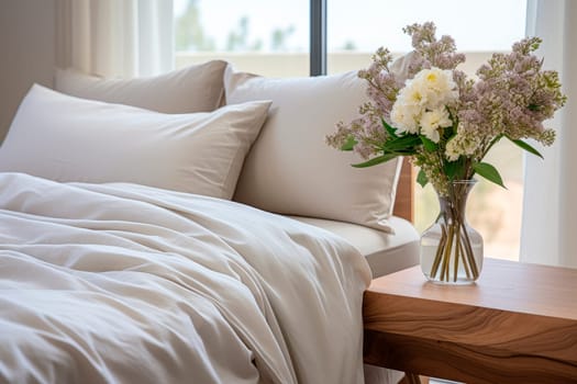 Flowers vase on night table in a bright bedroom. Beautiful fresh flowers in a vase on a table next to bed with gorgeous organic linens. AI generated