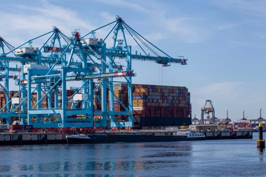 Rotterdam, Holland. Aerial view of container terminal in the harbor MAASVLAKTE, Netherlands. A large containership is unloading