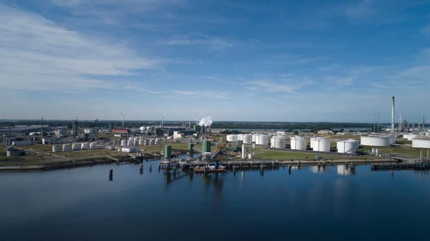 Oil refinery plant from industry zone, Aerial view oil and gas industrial, Refinery factory oil storage tank and pipeline steel