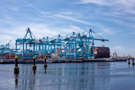 Rotterdam, Holland. Aerial view of container terminal in the harbor MAASVLAKTE, Netherlands. A large containership is unloading