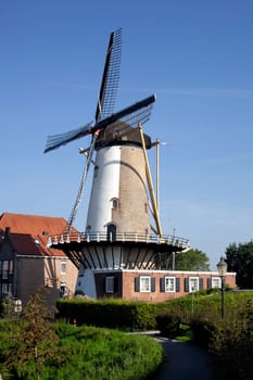 Windmill farm river landscape. Windmill farm scene. Village windmill farm river. Windmill farm river view