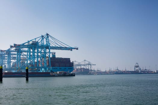 Rotterdam, Holland. Aerial view of container terminal in the harbor MAASVLAKTE, Netherlands. A large containership is unloading