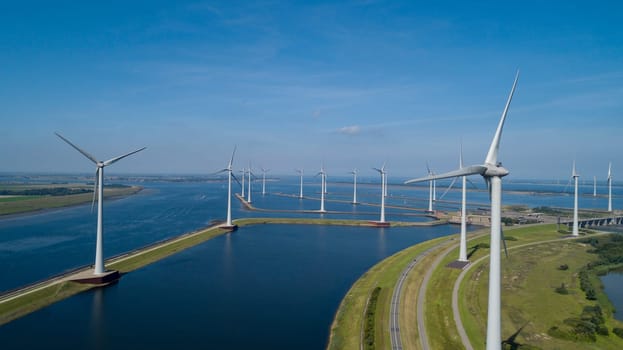 Wind turbine from aerial view, Drone view at windpark krammersluizen a windmill farm in the lake grevelingen in the Netherlands,Sustainable development, renewable energy