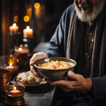 hands of a homeless person receiving a bowl of hot food at a volunteer center.concept of care and assistance to the homeless, the poor and those affected by natural disasters and wars.