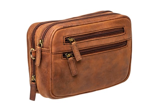 Leather handbag isolated. Close-up of brown businessman luxury leather wrist handbag. Clipping Path. Fashionable brown leather briefcase or bag for men.