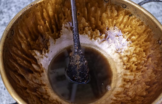 Detail of melted sugar in a copper pot, sweet