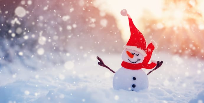 Little handmade snowman on the white snow on snowy background. Beautiful panoramic view.